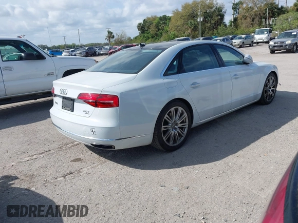 2015 Audi A8 L 4.0T with VIN WAU32AFD4FN002639, listed as a IAAI auction lot 41703951 with 103,722 mi miles. Bid and sale history available at carsss.com. Image 4.