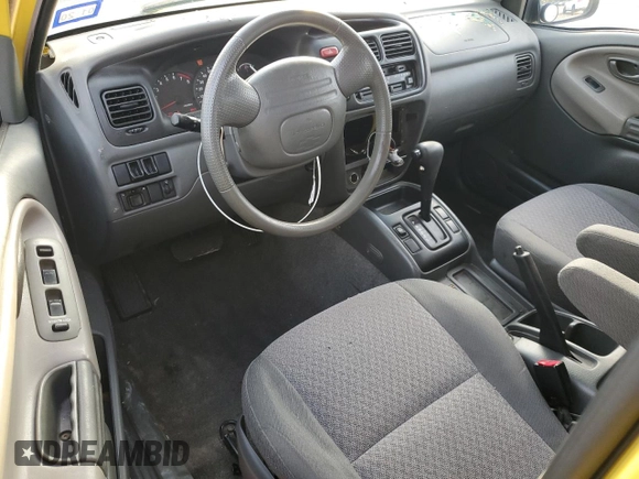 2003 Chevrolet Tracker z VIN 2CNBE18C136928311, wystawiony jako Copart lot #84463154 z przebiegiem 118 195 mil mil oraz Szkoda całkowita • Salvage title. Historia ofert i sprzedaży dostępna na DreamBid. Obrazek 8.