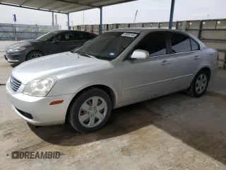 2008 Kia Optima LX z VIN KNAGE123285252289, wystawiony jako Copart lot #53054145 z przebiegiem 119 574 mil mil oraz Szkoda całkowita • Salvage title. Historia ofert i sprzedaży dostępna na DreamBid. Obrazek 1.