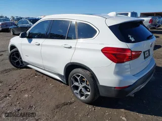 2017 BMW X1 xDrive28i with VIN WBXHT3C37H5F69725, listed as a IAAI auction lot 41588095 with 109,704 mi miles. Bid and sale history available at carsss.com. Image 3.