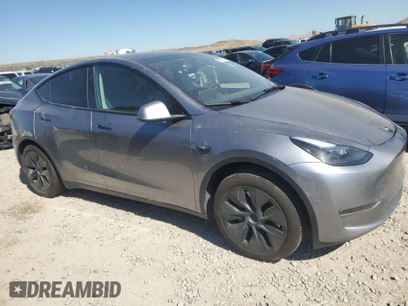 2024 Tesla Model Y Long Range with VIN 7SAYGDEE6RA321064, listed as a Copart auction lot 58889795 with 48,857 mi miles and Salvage title. Bid and sale history available at DreamBid. Image 4.