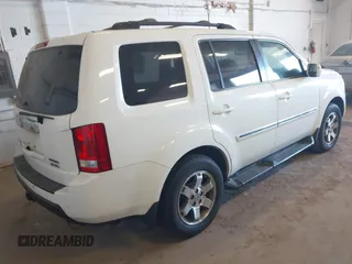 2010 Honda Pilot Touring with VIN 5FNYF4H95AB019903, listed as a IAAI auction lot 42196082 with 233,527 mi miles and . Bid and sale history available at carsss.com. Image 4.