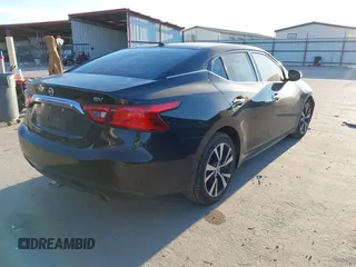 2016 Nissan Maxima Platinum z VIN 1N4AA6AP6GC430470, wystawiony jako IAAI lot #41390041 z przebiegiem 86 483 mil mil oraz . Historia ofert i sprzedaży dostępna na DreamBid. Obrazek 4.
