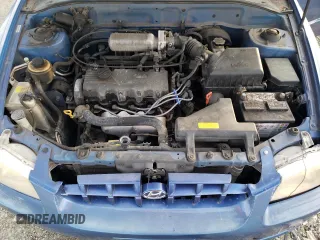 2000 Hyundai Accent z VIN KMHCG45GXYU125691, wystawiony jako Copart lot #87253294 z przebiegiem 91 062 mil mil oraz Szkoda całkowita • Salvage title. Historia ofert i sprzedaży dostępna na DreamBid. Obrazek 11.