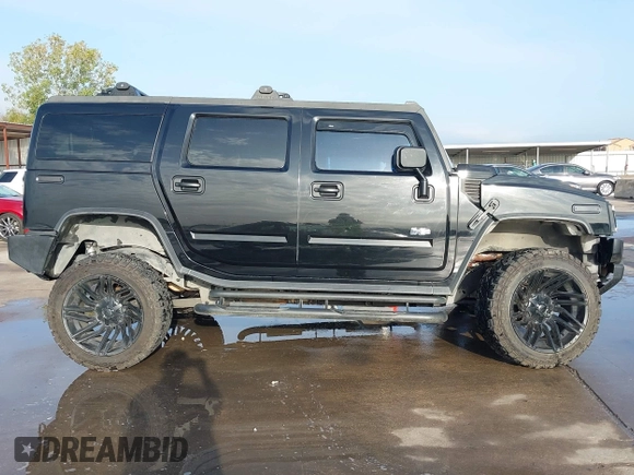 2003 Hummer H2 z VIN 5GRGN23UX3H112173, wystawiony jako IAAI lot #41093359 z przebiegiem Nie podano mil oraz . Historia ofert i sprzedaży dostępna na DreamBid. Obrazek 14.