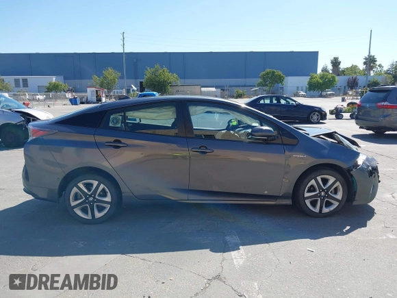 2016 Toyota Prius Four z VIN JTDKARFUXG3019426, wystawiony jako IAAI lot #42385785 z przebiegiem 94 838 mil mil oraz . Historia ofert i sprzedaży dostępna na DreamBid. Obrazek 13.