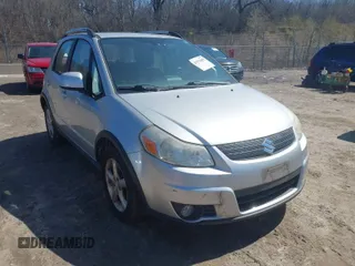 2009 Suzuki SX4 Man Touring Pkg AWD with VIN JS2YB417295100879, listed as a IAAI auction lot 41979405 with 69,625 mi miles. Bid and sale history available at carsss.com. Image 1.