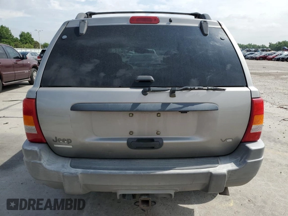 2000 Jeep Grand Cherokee Laredo with VIN 1J4GW48N1YC324356, listed as a Copart auction lot 62011305 with 242,322 mi miles and Salvage title. Bid and sale history available at DreamBid. Image 6.