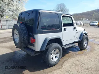 2006 Jeep Wrangler X with VIN 1J4FA39S16P787614, listed as a IAAI auction lot 41992315 with 61,788 mi miles. Bid and sale history available at carsss.com. Image 4.