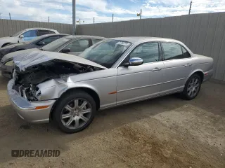 2004 Jaguar XJ with VIN SAJEA74C34SG09548, listed as a Copart auction lot 71754774 with 142,804 mi miles and Salvage Title. Bid and sale history available at DreamBid. Image 1.