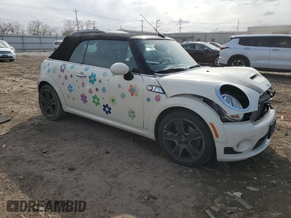 2010 MINI Convertible S with VIN WMWMS3C51ATZ85166, listed as a Copart auction lot 52907775 with 90,090 mi miles and Salvage title. Bid and sale history available at DreamBid. Image 4.