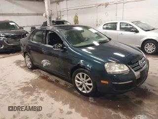 2009 Volkswagen Jetta z VIN 3VWHZ71K79M020139, wystawiony jako IAAI lot #42292767 z przebiegiem 156 619 mil mil oraz . Historia ofert i sprzedaży dostępna na DreamBid. Obrazek 1.