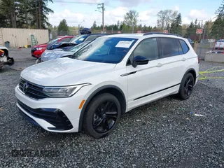 2023 Volkswagen Tiguan SE R-Line Black with VIN 3VVCB7AX3PM014446, listed as a IAAI auction lot 42016885 with 12,726 mi miles and . Bid and sale history available at DreamBid. Image 2.