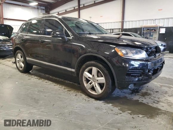 2011 Volkswagen Touareg Exec with VIN WVGFK9BP8BD003948, listed as a Copart auction lot 48285065 with 152,497 mi miles and Salvage Title. Bid and sale history available at DreamBid. Image 4.
