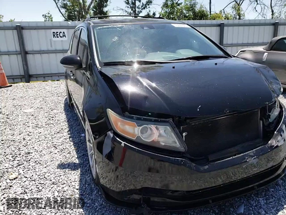 2014 Honda Odyssey Touring with VIN 5FNRL5H97EB016624, listed as a Copart auction lot 53444645 with 244,126 mi miles and Salvage Title. Bid and sale history available at DreamBid. Image 12.