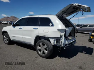 2014 Jeep Grand Cherokee Limited with VIN 1C4RJFBT2EC471846, listed as a Copart auction lot 63637415 with 130,262 mi miles and Salvage title. Bid and sale history available at DreamBid. Image 2.