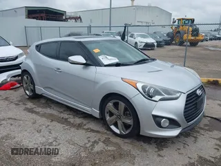 2013 Hyundai Veloster Turbo z VIN KMHTC6AE2DU122273, wystawiony jako IAAI lot #42174272 z przebiegiem 157 152 mil mil oraz . Historia ofert i sprzedaży dostępna na DreamBid. Obrazek 1.