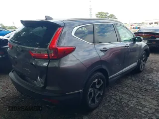 2018 Honda CR-V Touring z VIN 7FARW1H9XJE040530, wystawiony jako IAAI lot #42227446 z przebiegiem 101 299 mil mil oraz . Historia ofert i sprzedaży dostępna na DreamBid. Obrazek 13.