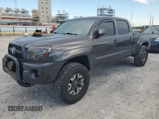 2011 Toyota Tacoma PreRunner with VIN 3TMKU4HN2BM027673, listed as a Copart auction lot 62064335 with 218,453 mi miles and Salvage title. Bid and sale history available at DreamBid. Image 1.