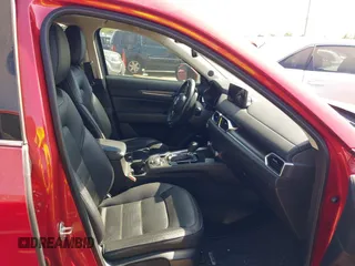2021 Mazda CX-5 Grand Touring with VIN JM3KFADM4M0476615, listed as a IAAI auction lot 42004814 with 42,483 mi miles. Bid and sale history available at carsss.com. Image 5.