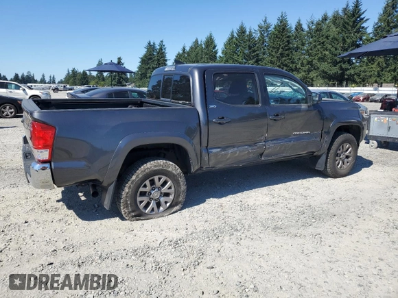 2017 Toyota Tacoma SR5 with VIN 3TMCZ5ANXHM052092, listed as a Copart auction lot 64898135 with 95,743 mi miles and Salvage title. Bid and sale history available at DreamBid. Image 3.