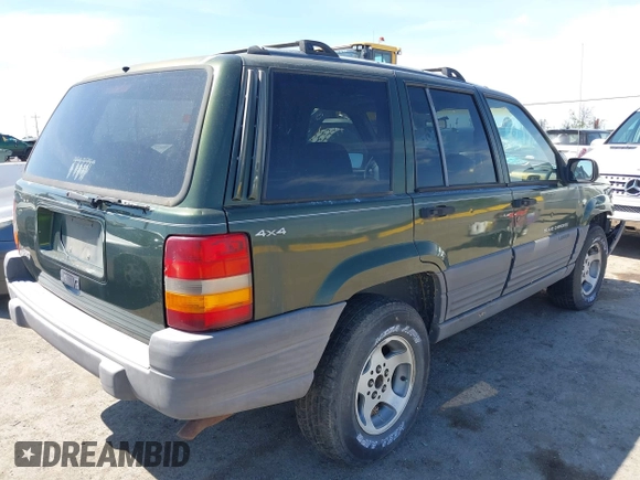 1996 Jeep Grand Cherokee Laredo with VIN 1J4GZ58S7TC280276, listed as a IAAI auction lot 42120454 with 230,617 mi miles. Bid and sale history available at carsss.com. Image 4.
