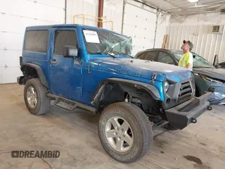 2015 Jeep Wrangler Rubicon Hard Rock z VIN 1C4BJWCG3FL568848, wystawiony jako IAAI lot #42243059 z przebiegiem 60 860 mil mil oraz . Historia ofert i sprzedaży dostępna na DreamBid. Obrazek 1.