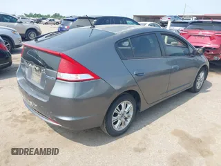 2010 Honda Insight EX with VIN JHMZE2H71AS043465, listed as a IAAI auction lot 42312556 with 151,009 mi miles and . Bid and sale history available at DreamBid. Image 4.