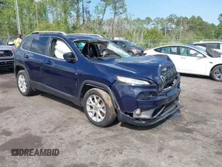 2015 Jeep Cherokee Latitude with VIN 1C4PJLCB5FW694359, listed as a IAAI auction lot 41934213 with 117,723 mi miles and . Bid and sale history available at DreamBid. Image 1.