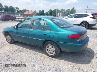 1997 Ford Escort LX with VIN 1FALP13P8VW184766, listed as a IAAI auction lot 40039873 with 104,604 mi miles. Bid and sale history available at carsss.com. Image 3.