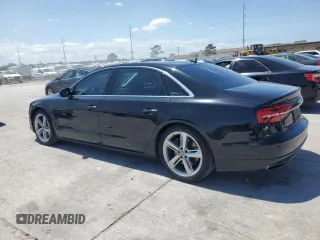 2018 Audi A8 z VIN WAU44AFD0JN000880, wystawiony jako Copart lot #54751235 z przebiegiem 76 161 mil mil oraz Szkody całkowita. Historia ofert i sprzedaży dostępna na DreamBid. Obrazek 2.
