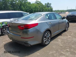 2014 Kia Optima SX with VIN 5XXGR4A75EG270693, listed as a IAAI auction lot 42606134 with 126,486 mi miles and . Bid and sale history available at DreamBid. Image 4.