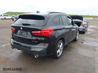 2021 BMW X1 xDrive28i with VIN WBXJG9C01M3M71033, listed as a IAAI auction lot 41723970 with 71,000 mi miles. Bid and sale history available at carsss.com. Image 4.