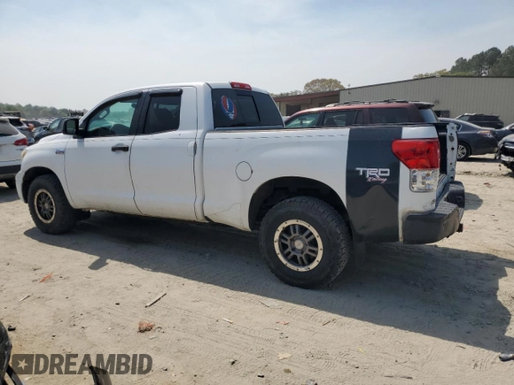 2010 Toyota Tundra 4WD Truck with VIN 5TFUY5F1XAX123787, listed as a Copart auction lot 54447555 with 242,821 mi miles and Clean Title. Bid and sale history available at carsss.com. Image 2.