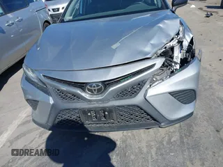 2019 Toyota Camry LE z VIN 4T1B11HKXKU259233, wystawiony jako IAAI lot #41870621 z przebiegiem 31 425 mil mil oraz . Historia ofert i sprzedaży dostępna na DreamBid. Obrazek 12.