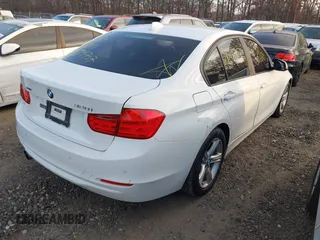 2014 BMW 3 Series 328i xDrive with VIN WBA3B5C52EF958635, listed as a IAAI auction lot 40916777 with 143,975 mi miles. Bid and sale history available at carsss.com. Image 4.