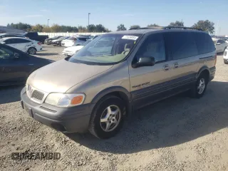 1997 Pontiac Montana z VIN 1GMDX03EXVD290246, wystawiony jako Copart lot #77526084 z przebiegiem 127 447 mil mil oraz Szkoda całkowita • Salvage title. Historia ofert i sprzedaży dostępna na DreamBid. Obrazek 1.