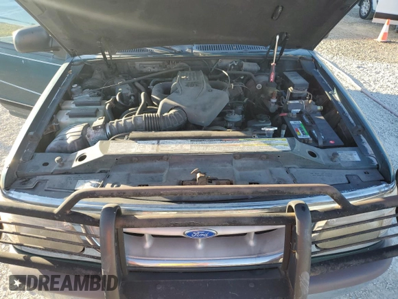 1997 Ford Explorer XL with VIN 1FMDU34E5VZB40878, listed as a Copart auction lot 84009744 with 185,047 mi miles and Salvage title. Bid and sale history available at DreamBid. Image 12.