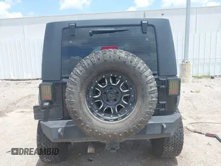 2008 Jeep Wrangler Unlimited X z VIN 1J4GA39148L560004, wystawiony jako IAAI lot #42523657 z przebiegiem 116 619 mil mil oraz . Historia ofert i sprzedaży dostępna na DreamBid. Obrazek 16.