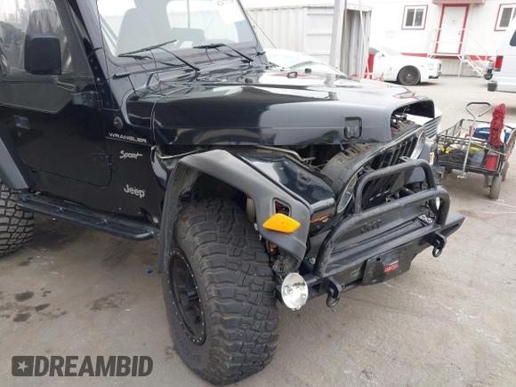 2002 Jeep Wrangler Sport with VIN 1J4FA49S02P705470, listed as a IAAI auction lot 42477770 with 59,395 mi miles and . Bid and sale history available at DreamBid. Image 6.