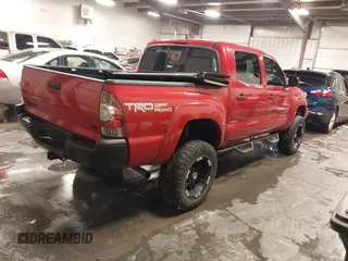 2015 Toyota Tacoma with VIN 3TMLU4EN3FM196518, listed as a IAAI auction lot 41198481 with 96,277 mi miles and . Bid and sale history available at DreamBid. Image 4.