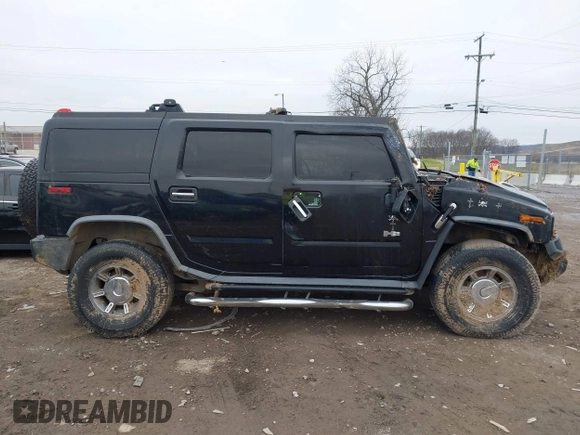 2007 Hummer H2 SUV z VIN 5GRGN23UX7H111093, wystawiony jako IAAI lot #41262675 z przebiegiem Nie podano mil oraz . Historia ofert i sprzedaży dostępna na DreamBid. Obrazek 14.