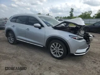 2016 Mazda CX-9 Signature with VIN JM3TCBEY1G0121667, listed as a Copart auction lot 54974805 with Not provided miles and Salvage title. Bid and sale history available at DreamBid. Image 4.