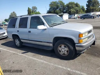 1995 Chevrolet Tahoe with VIN 1GNEK13K6SJ415105, listed as a Copart auction lot 65960124 with 219,821 mi miles and Salvage Title. Bid and sale history available at carsss.com. Image 4.