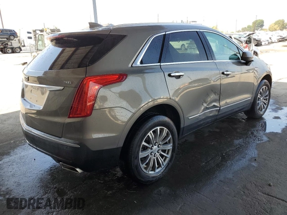 2019 Cadillac XT5 Luxury FWD z VIN 1GYKNCRS4KZ221304, wystawiony jako Copart lot #54995415 z przebiegiem 128 940 mil mil oraz Szkoda całkowita • Salvage title. Historia ofert i sprzedaży dostępna na DreamBid. Obrazek 3.