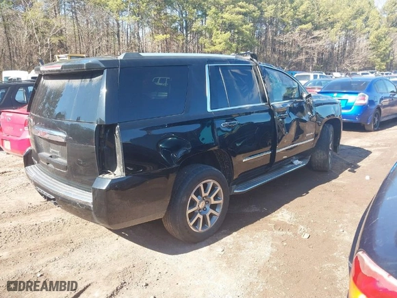 2016 GMC Yukon Denali with VIN 1GKS1CKJ2GR128618, listed as a IAAI auction lot 40009657 with 175,776 mi miles. Bid and sale history available at carsss.com. Image 4.
