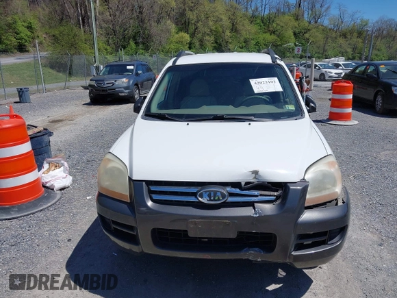 2006 Kia Sportage LX with VIN KNDJF723567151614, listed as a IAAI auction lot 42022102 with 128,564 mi miles and . Bid and sale history available at carsss.com. Image 12.