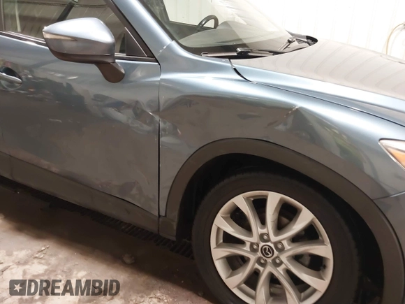 2015 Mazda CX-5 Grand Touring with VIN JM3KE4DY7F0504398, listed as a IAAI auction lot 41698365 with 122,121 mi miles. Bid and sale history available at carsss.com. Image 6.