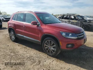 2014 Volkswagen Tiguan SE with VIN WVGAV3AX9EW038118, listed as a Copart auction lot 56329625 with 134,620 mi miles and Salvage title. Bid and sale history available at DreamBid. Image 4.
