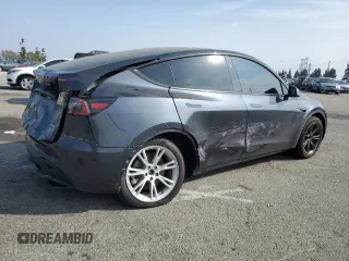 2024 Tesla Model Y Long Range with VIN 7SAYGDEE2RA244242, listed as a Copart auction lot 52635095 with 4,994 mi miles and Salvage title. Bid and sale history available at DreamBid. Image 3.